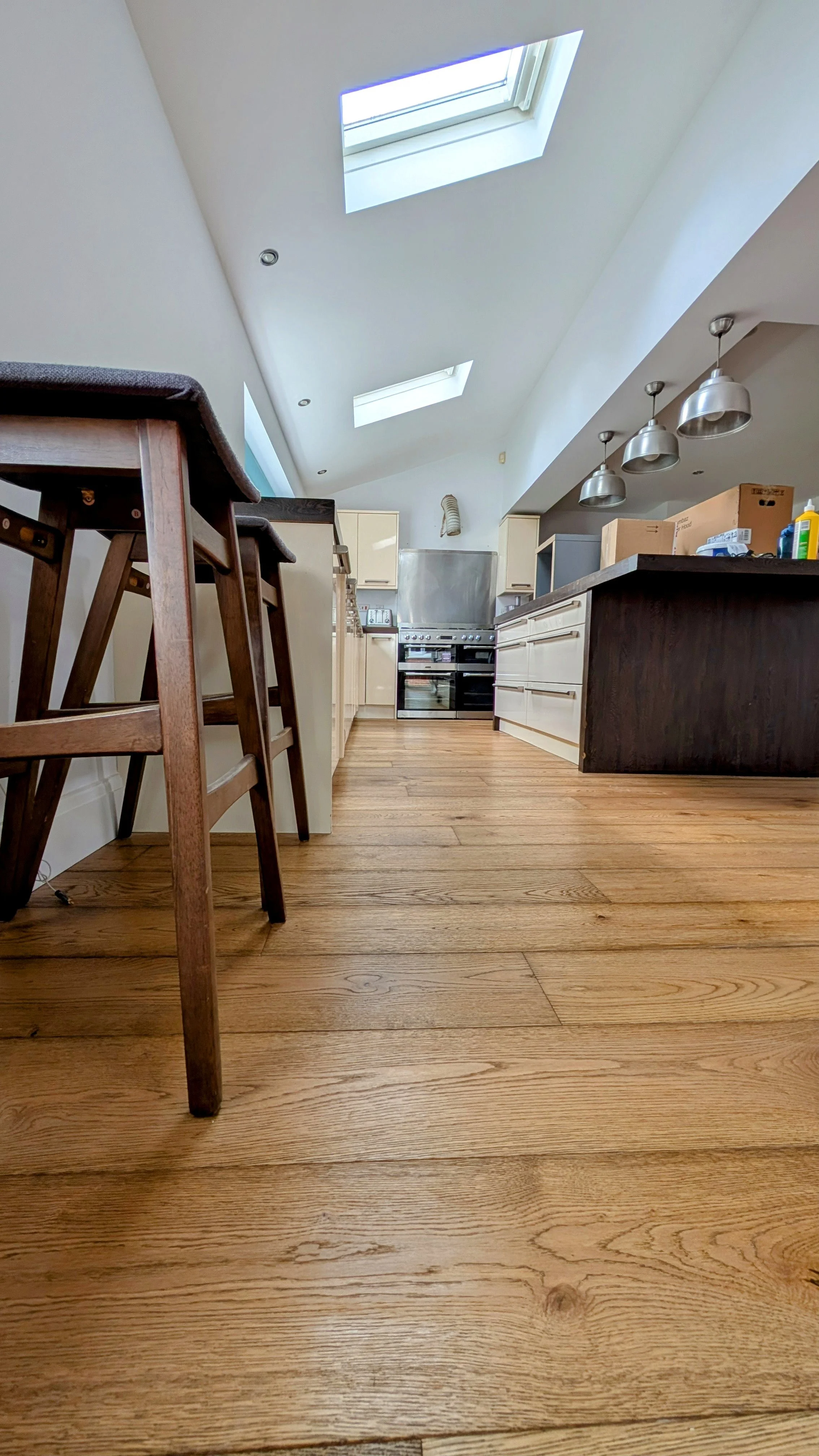 Wood flooring installed around a kitchen island