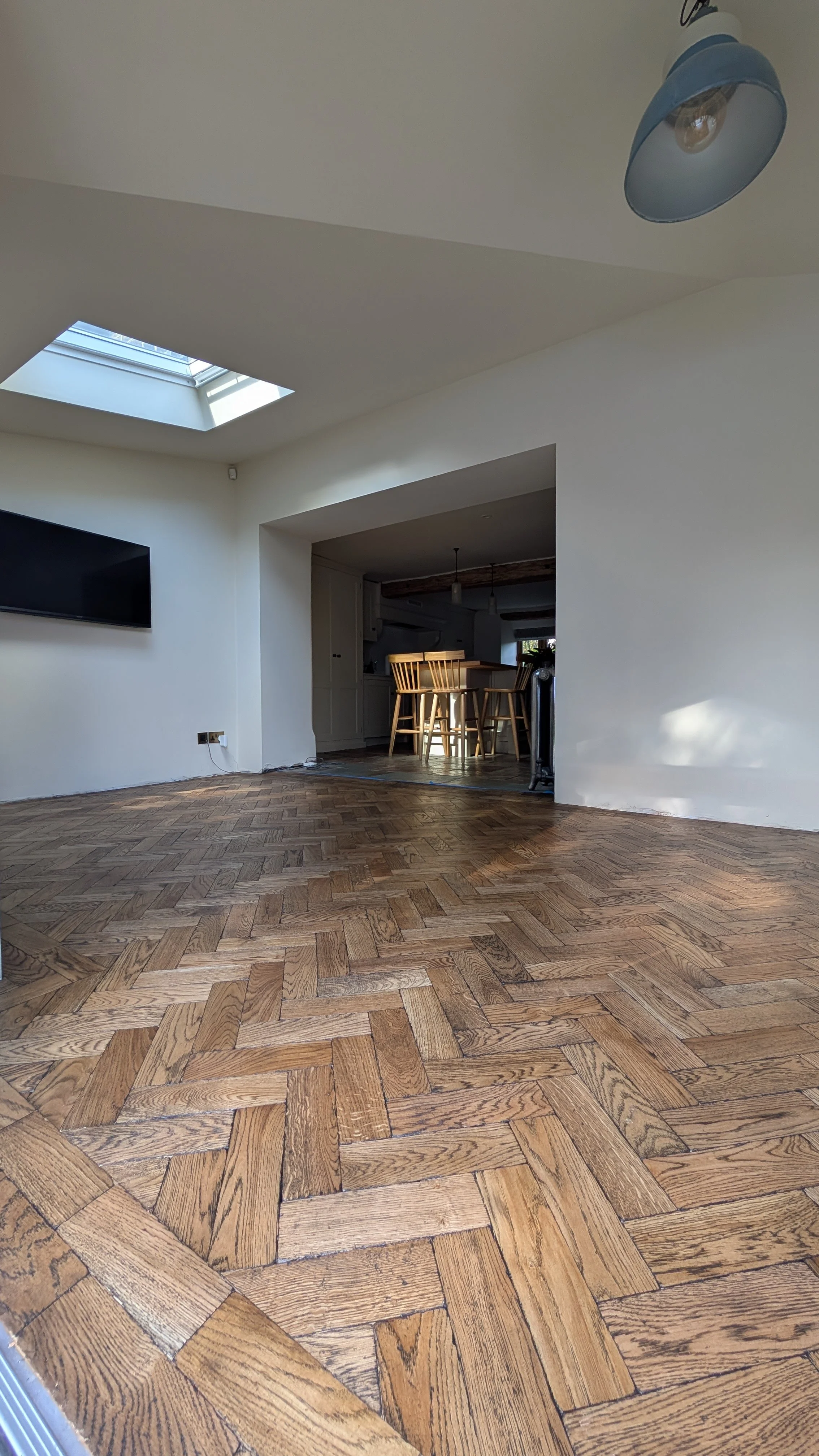 Solid oak herringbone installed in a sun room