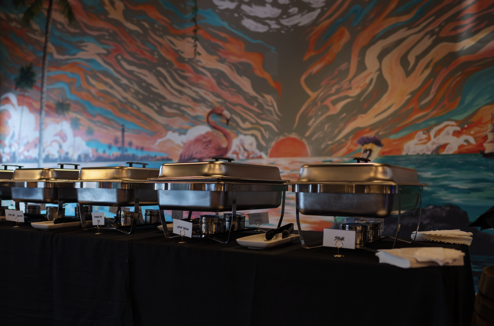 Catering setup with chafing dishes keeping food warm