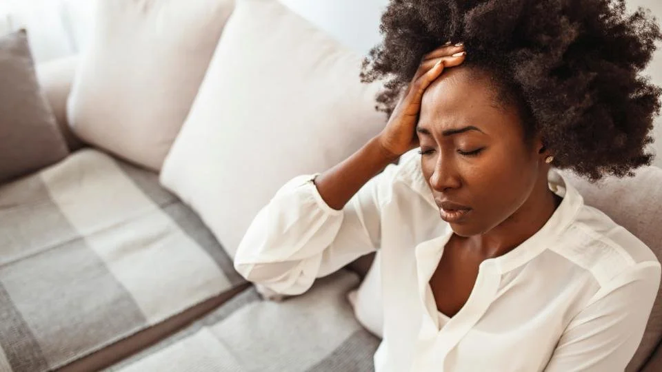 Woman suffering from CSF Leak headache