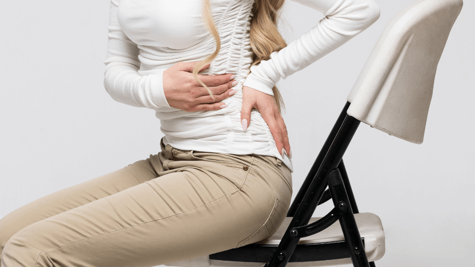Woman with back pain from spinal arthritis