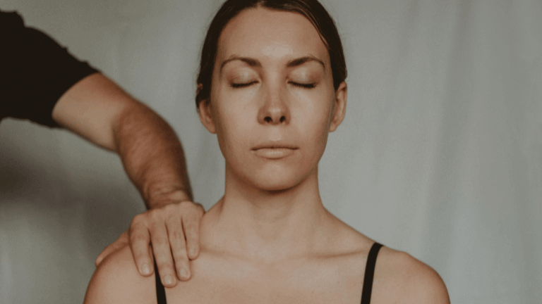 Woman seeking relief from trapped nerve in shoulder