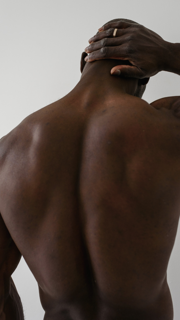 Man touching his neck because he has chronic back pain