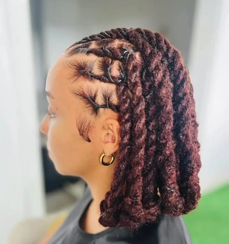 Woman with braided loc hairstyle and hoop earrings