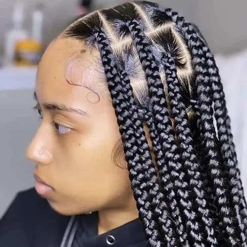 Intricate cornrow hairstyle with geometric patterns