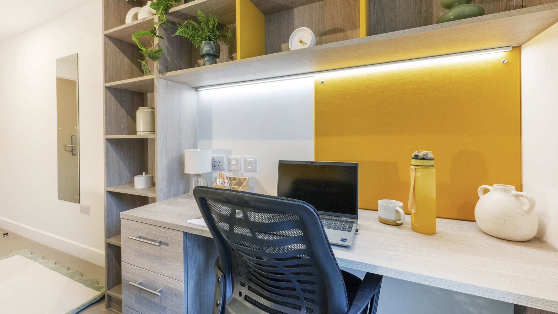 Bespoke study desk and noticeboard within a Timber Yard Bristol student bedroom, designed to support study and organisation.
