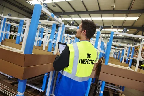 Deanestor quality team inspecting furniture components to ensure compliance and workmanship standards.