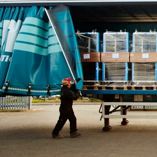 Deanestor delivery team transporting bespoke furniture for installation on a live project.