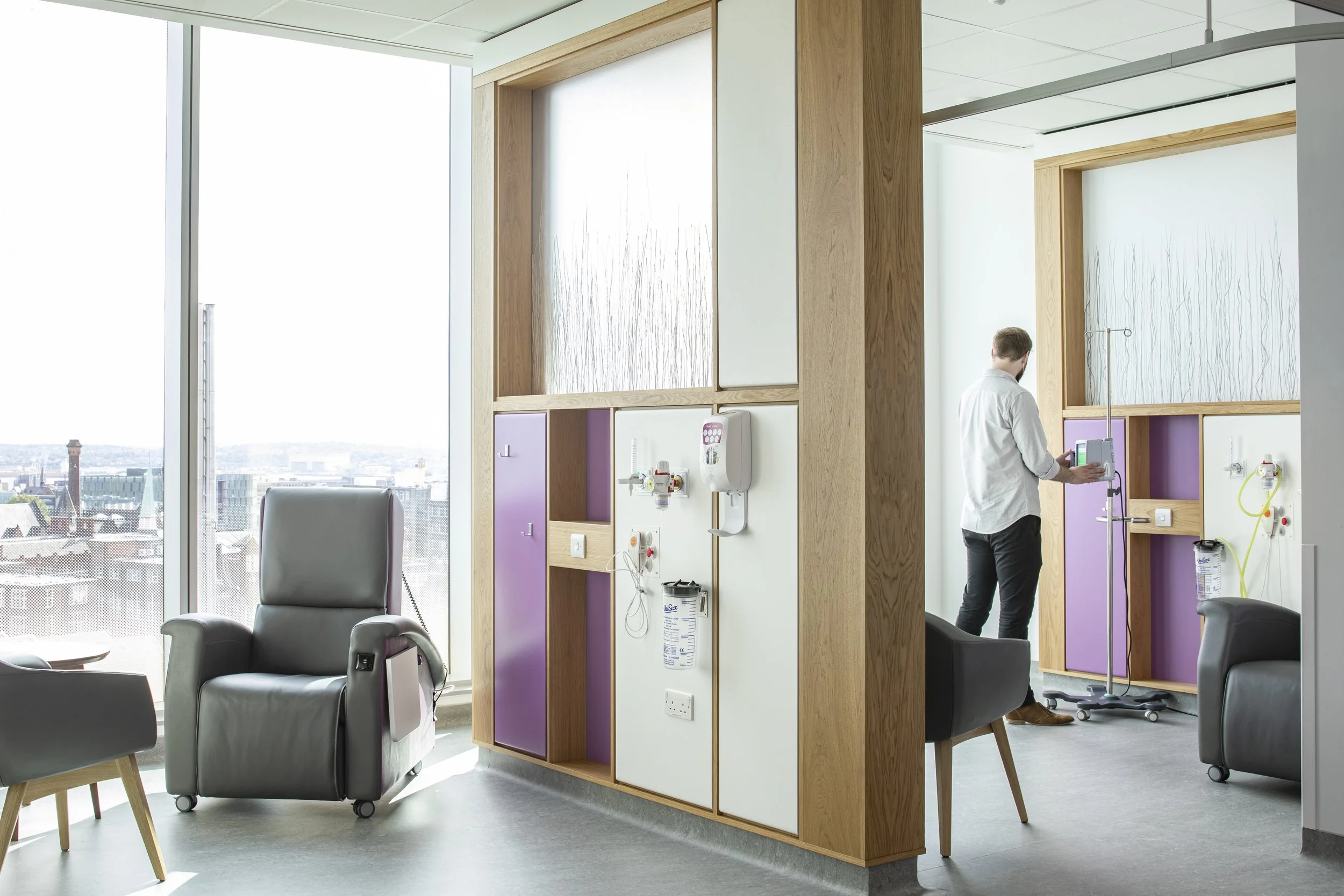 Custom healthcare furniture and treatment bay joinery at Clatterbridge Cancer Centre by Deanestor.