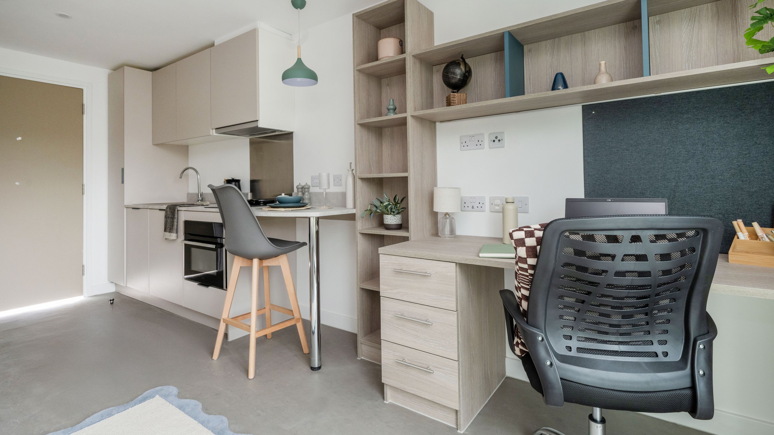 Bespoke study desk within a Timber Yard Bristol student bedroom, providing a practical workspace with integrated storage and shelving.