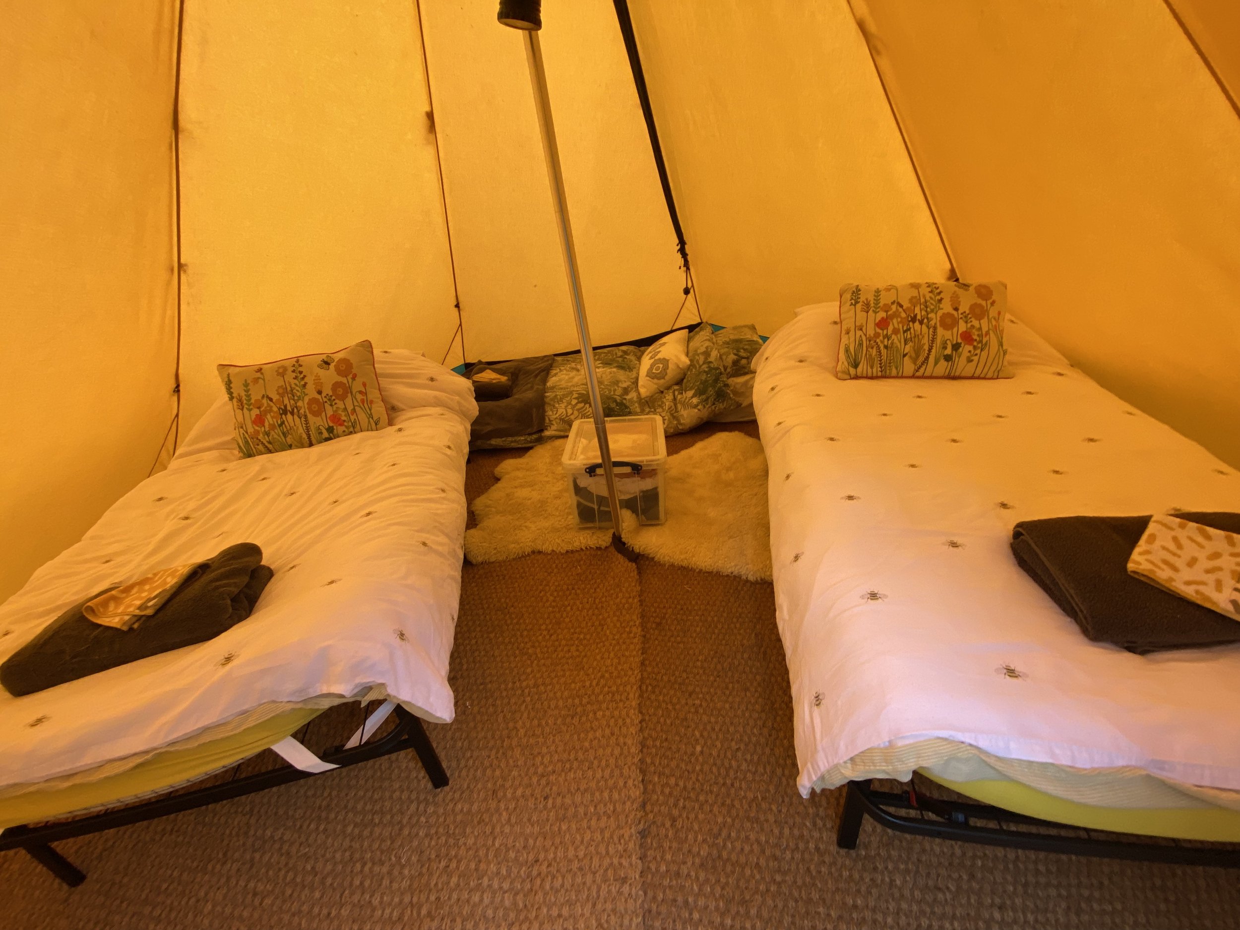 Two singles and an extra mattress in a tipi