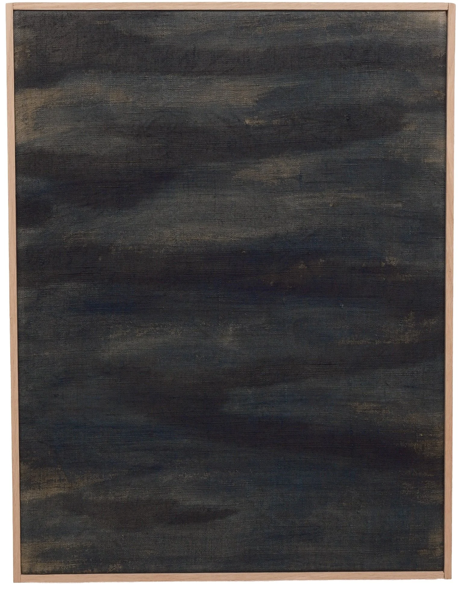 A large canvas painting with dark, swirling abstract patterns in black, blue, and hints of gold, framed with a light wooden border.