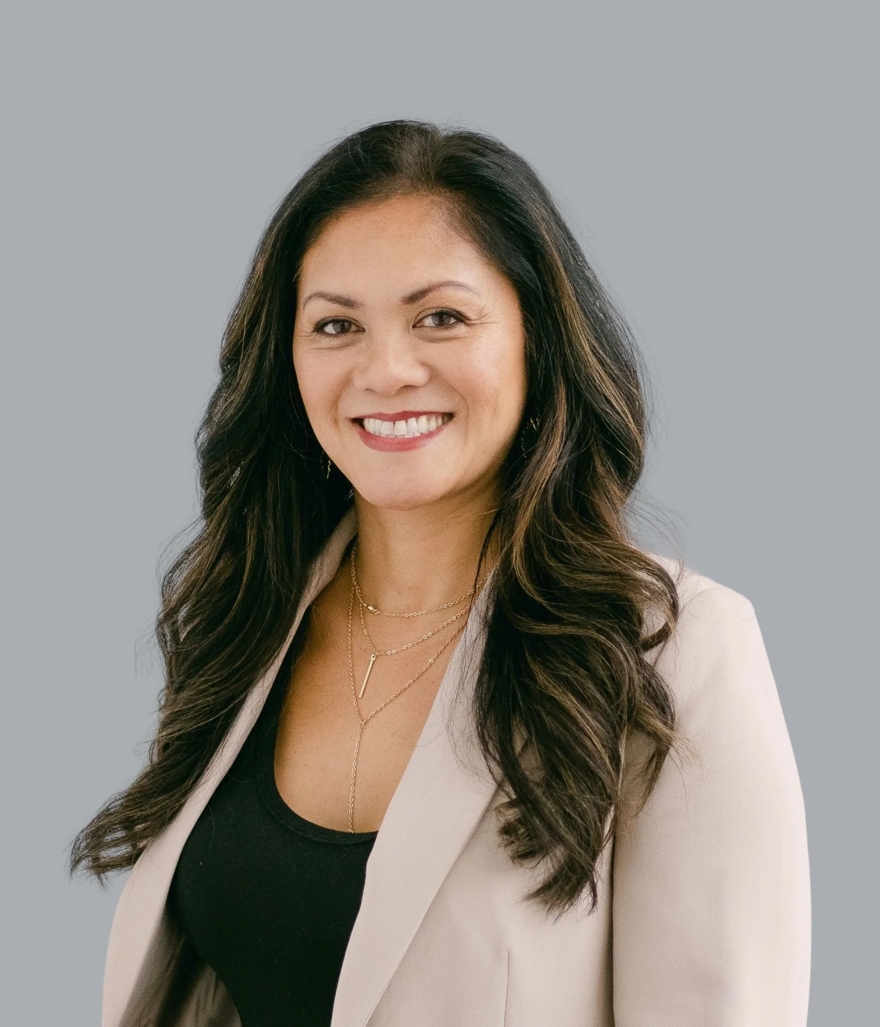 Asian middle-aged woman therapist smiling at the camera