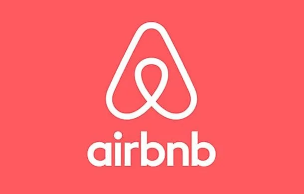 Airbnb logo on a red background