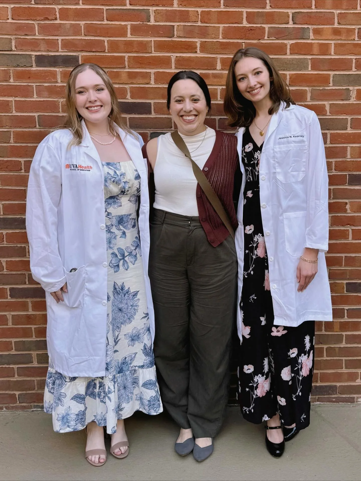 Jess and Deanna officially have their white coats! 🥼 Excited to watch their PhD journey unfold &mdash; congratulations to you both! #ProudPI We hope you both find joy and fun in your time with us! #phdstudents