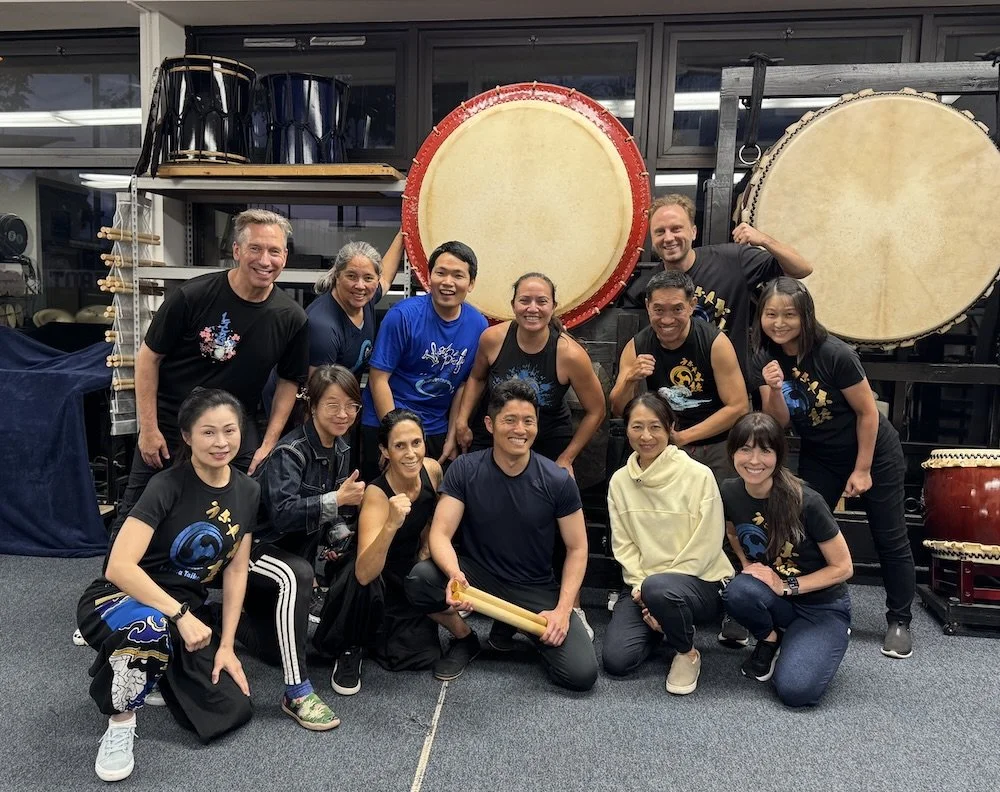 La Jolla Taiko group photo with Taiyo Onoda of Kodo in front of Japanese taiko drums