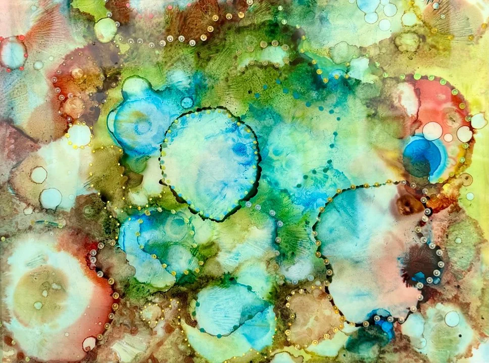 Abstract watercolor painting with blue, green, yellow, red, and brown circular patterns and gold dotted lines.