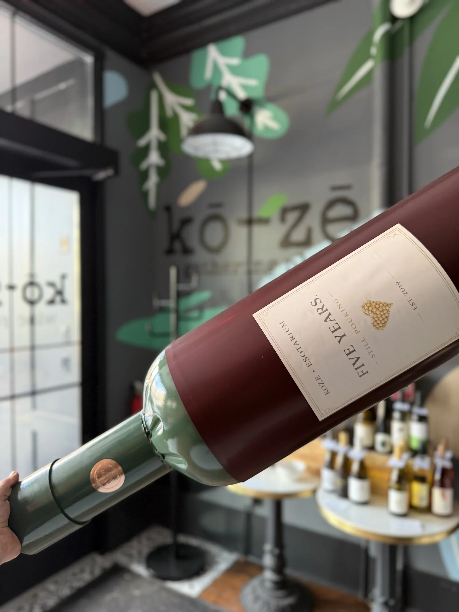 Oversized wine-bottle installation created for KoZe’s fifth anniversary.