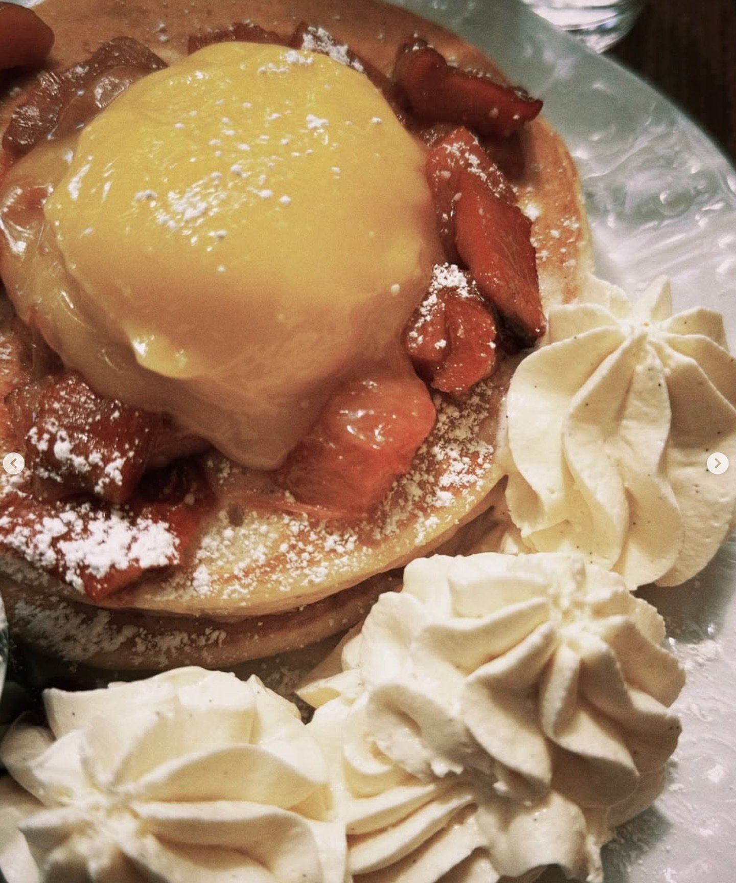 Fluffy ricotta pancakes 🥞 topped with tangy lemon curd, rhubarb compote, and whipped cream. A brunch favorite you won&rsquo;t want to miss while it&rsquo;s still on our menu.⁠
⁠
Lemon Curd &amp; Rhubarb Pancakes captured by @heavymetalkween⁠
⁠
#scre