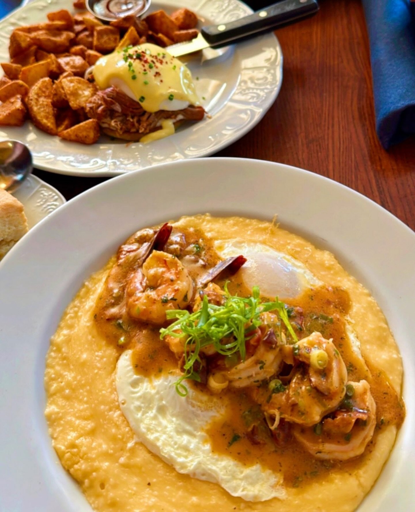 Lowcountry Shrimp &amp; Grits⁠ 
Five jumbo shrimp saut&eacute;ed in our signature tomato-garlic sauce with smoky bacon, served over creamy cheddar grits with two over-medium eggs and a buttermilk biscuit.⁠
⁠
Available for brunch at both locations!⁠
⁠