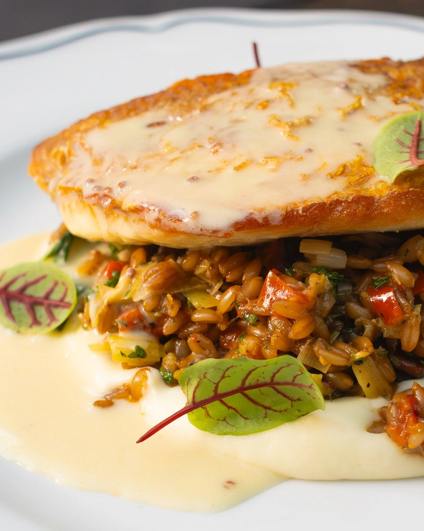 Easing into the new year after a season of holiday feasts? We&rsquo;ve got just the thing! Pan Roasted Snapper with farro, melted leeks, stewed peppers, parsnip cream, mustard greens, pecan persillade, and Creole mustard beurre blanc. Join us for din