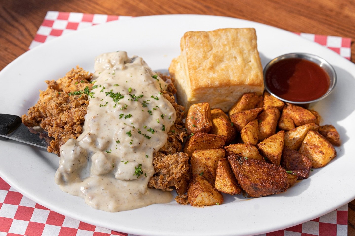 A little comfort in winter: Chicken &amp; Biscuits with crispy fried chicken breast smothered in country pork sausage gravy (or vegetarian mushroom gravy), paired with a buttermilk biscuit and crispy breakfast potatoes.⁠
⁠
We&rsquo;re here from 8:30a