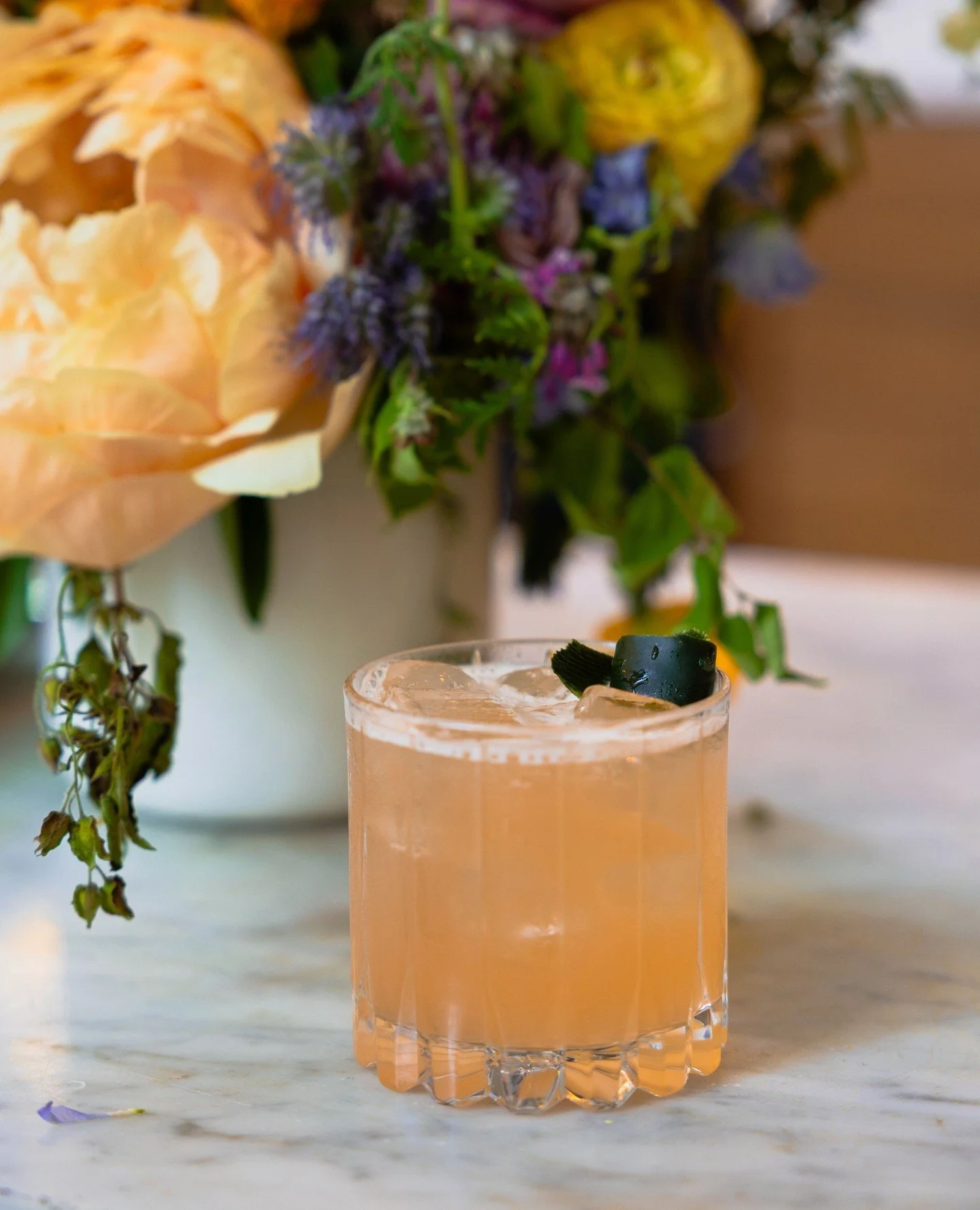 Meet the Elder Sister ✨ A bright, refreshing sipper made with house-infused cucumber gin, St. Elder elderflower liqueur, Aperol, lime juice &amp; simple syrup. Crisp, floral, and made for patio season in the Pearl.⁠
⁠
#screendoorpdx #craftcocktail #t