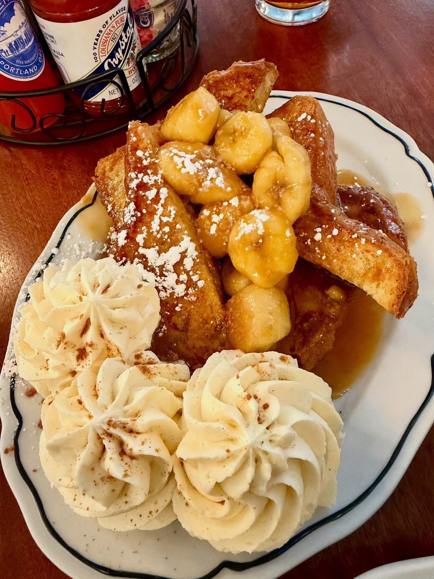 The camera always takes the first bite 📷⁠
Bananas Foster French Toast is one of those plates that gets photographed fast and finished faster. ⁠
⁠
📷 @shaeringtravels⁠
⁠
#screendoorpdx #pdxfood #portlandfood