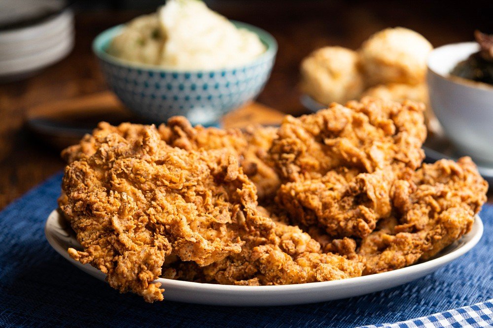 A feast for the whole family. 🍗 Our Family Meals come with your choice of our famous Fried Chicken or Memphis Style BBQ Ribs, plus all the fixings.⁠
⁠
The Chicken Dinner comes with mashed potatoes &amp; tasso ham gravy, cornbread, your choice of col