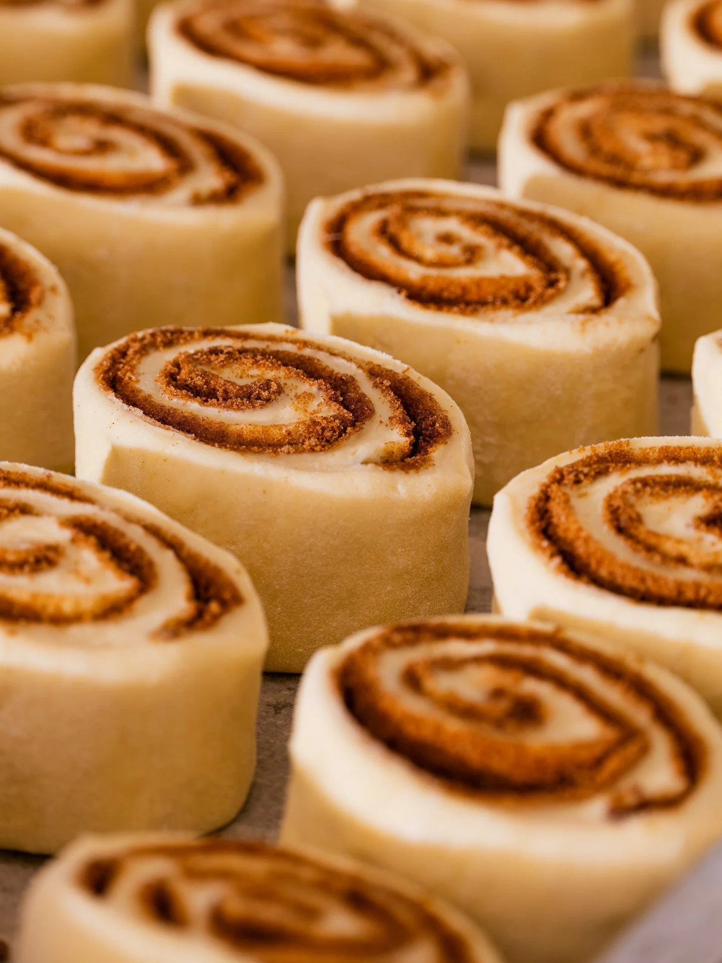 Sunday morning, in the works. 🌀 Cinnamon rolls rolled, prepped, and ready for the oven.⁠
⁠
We serve them two at a time, warm, filled with cream cheese, and made in-house by our bakery team. 💙⁠
⁠
#screendoorpdx #pdxfood #portlandfood #travelportland