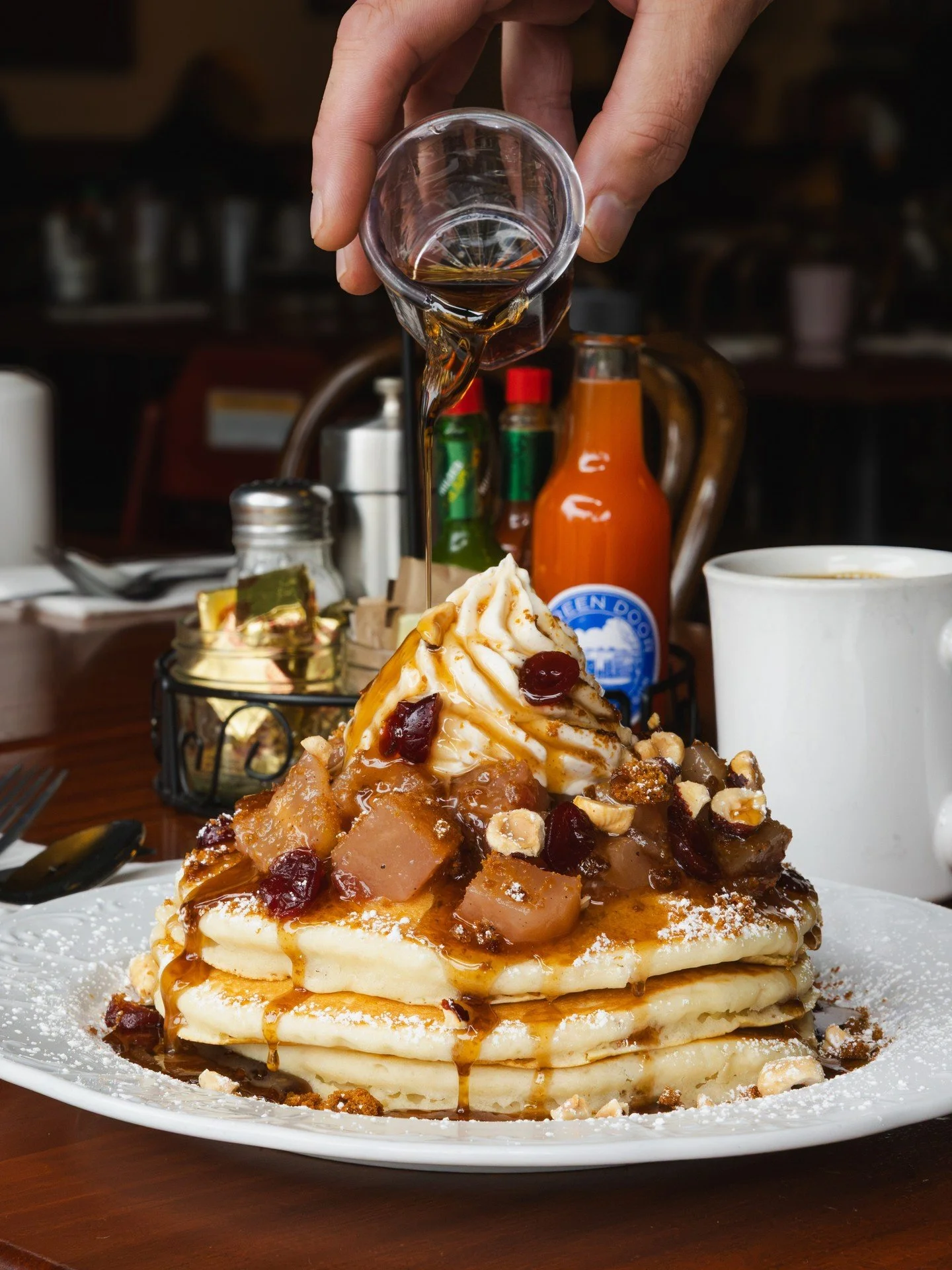A dreamy stack for your October brunch plans 🥞 Orchard Pear &amp; Ginger Crisp Pancakes. Three fluffy buttermilk pancakes with Hood River pear compote, chai spiced cream cheese whip, toasted hazelnuts, gingersnap crumble and cider poached cranberrie
