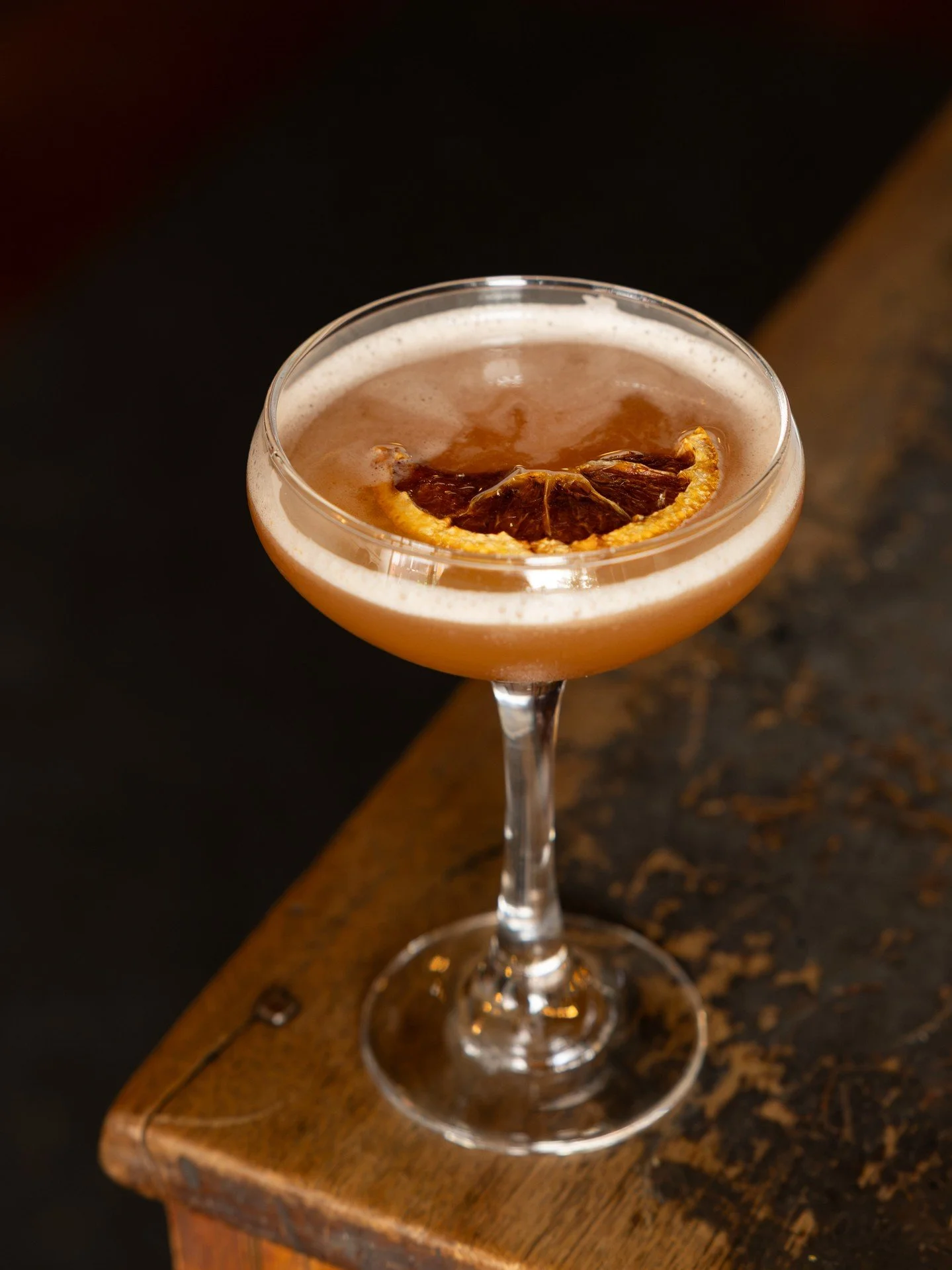 A little autumn in a glass. 🍂 Our Autumn Reserve is making a strong case for another round. Made with Hennessy, Applejack, St. Elizabeth Allspice Dram, lemon juice, simple syrup, and Angostura bitters, finished with a dried orange garnish.⁠
⁠
Find i