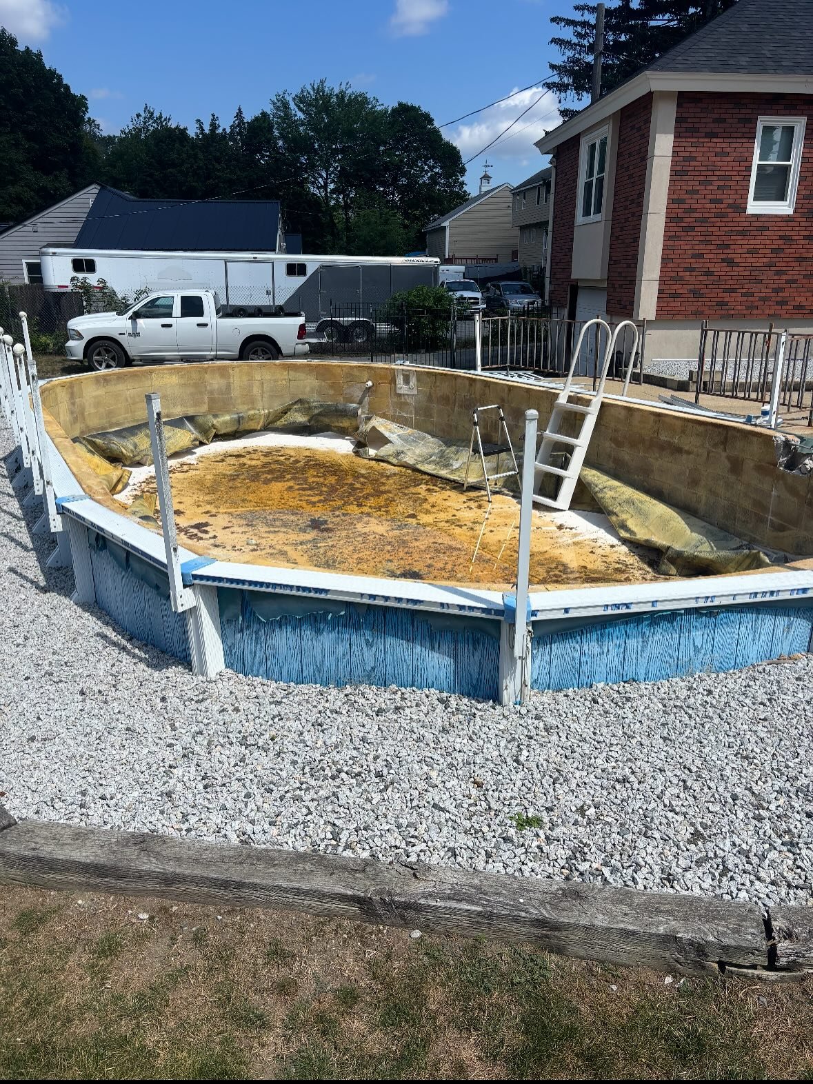 Check out this transformation !!💪
 
This above-ground pool was set halfway into the ground and reinforced with concrete block walls all around. Our client wanted it gone, so we tore out the pool walls, filled in the hole, and prepped the area for fr