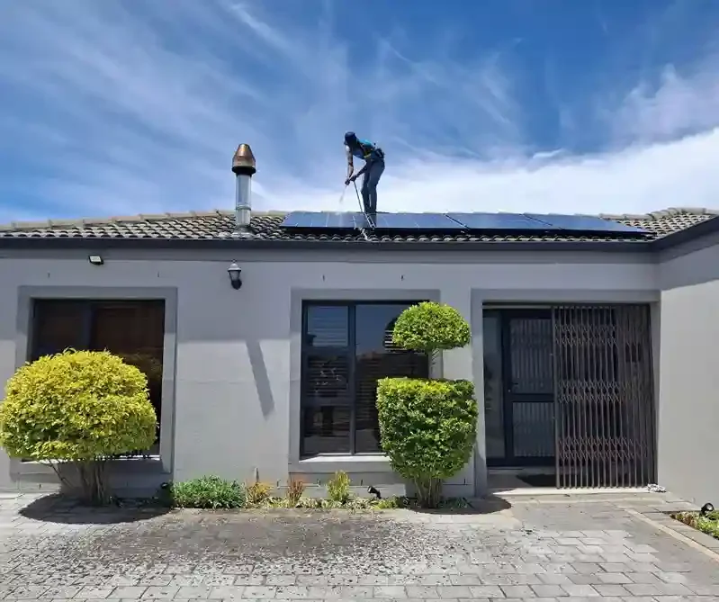 GRM Roofing technician working on solar panel detach and reset service on a residential rooftop in Ocean County, NJ