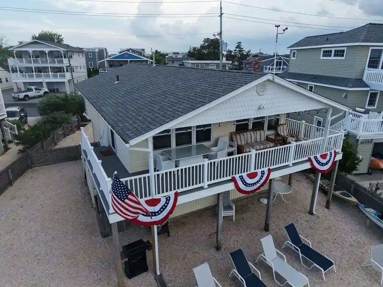 Close-up of a roofer checking shingles during a free roof inspection in Ocean County