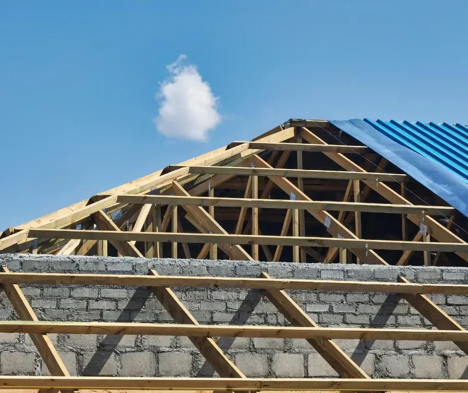 New roof truss framing and metal panel installation on a residential construction project in Brick Township NJ