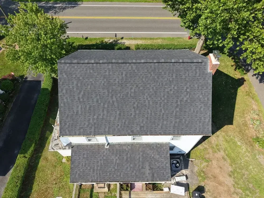 Completed roof replacement with solar panels reconnected by GRM Roofing in Ocean County, NJ