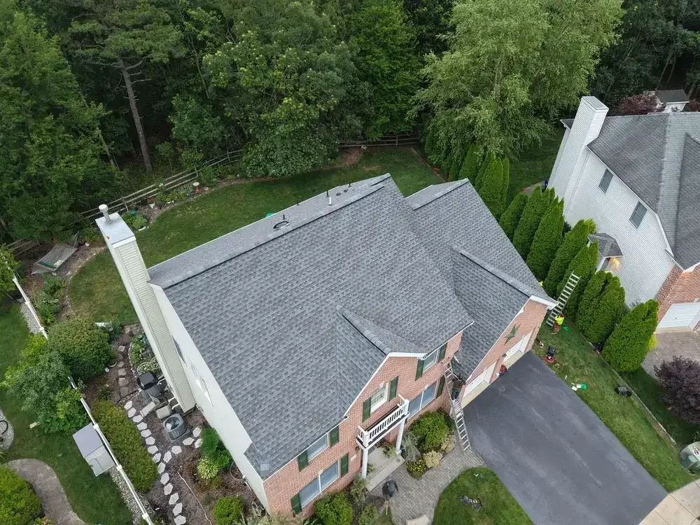 Workers installing a new roof system on a family home in Little Egg Harbor Township