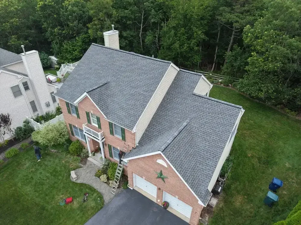 GRM Roofing team laying underlayment during a new roof installation in Southern NJ
