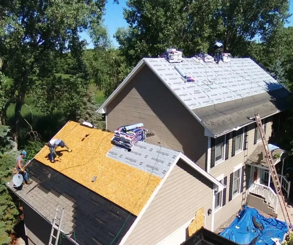 Ocean County NJ roof repair project with underlayment installation and shingle bundles stacked on exposed decking