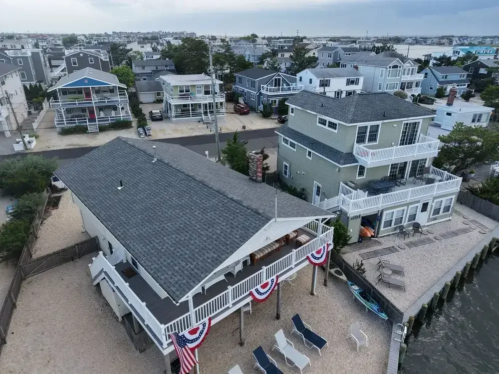 GRM Roofing crew installing new asphalt shingles on a home in Little Egg Harbor, NJ