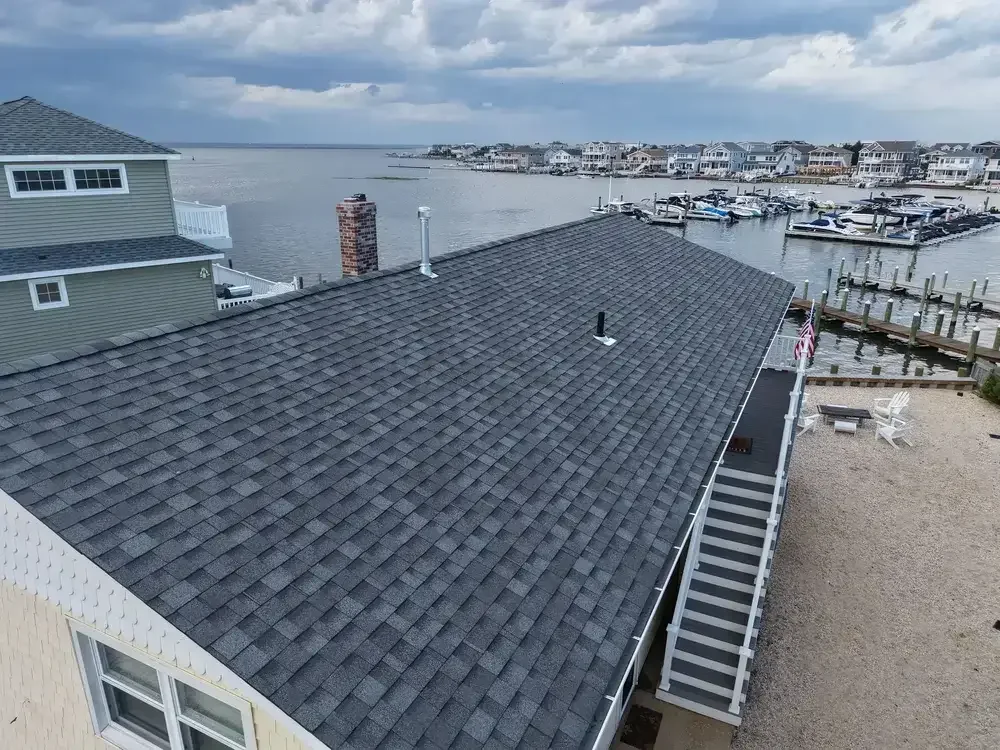 GRM Roofing team member documenting roof damage during an inspection in Southern NJ