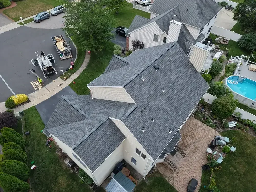 GRM Roofing technician installing drip edge flashing on a home in Ocean County