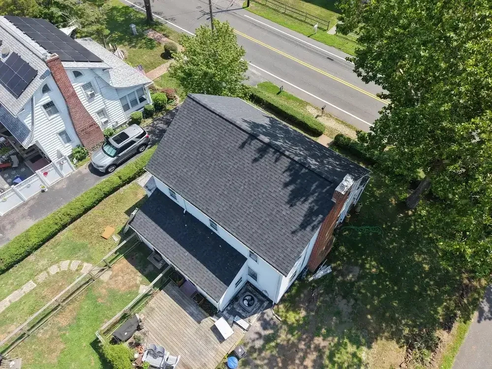 Seasonal roof maintenance service being performed in Little Egg Harbor Township