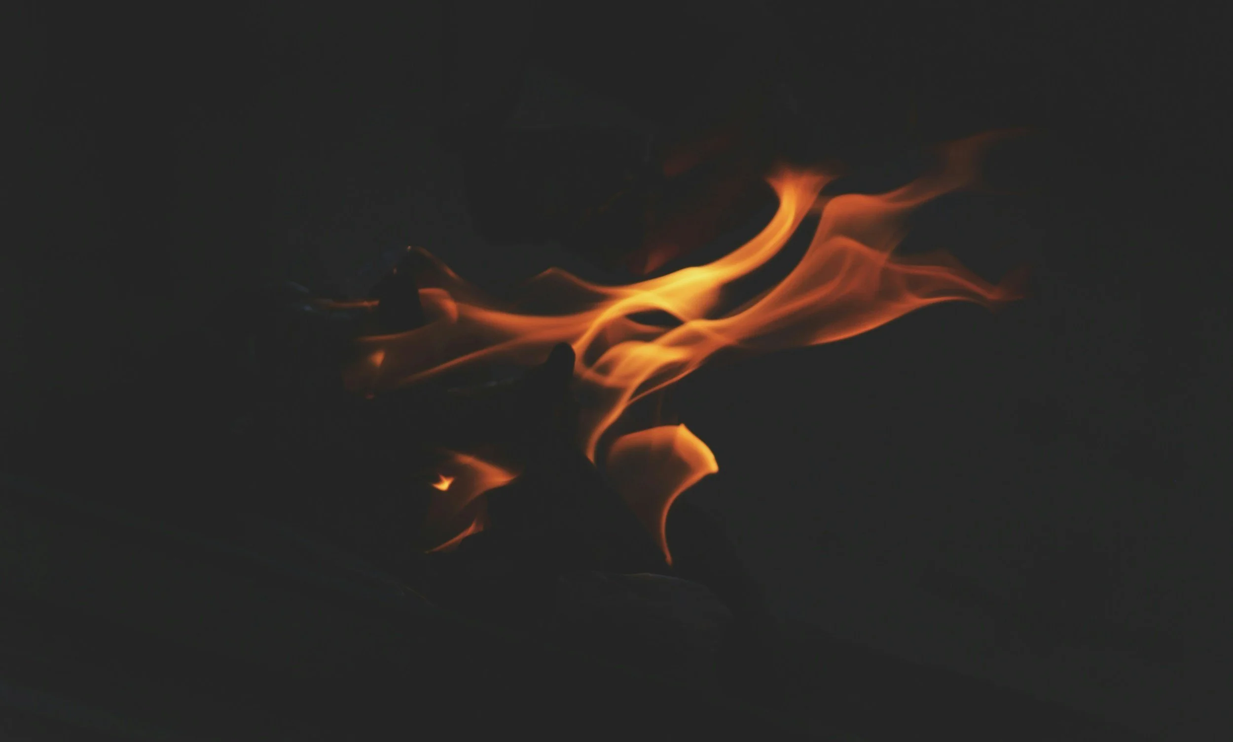 Flames in a dark background to inspire transformation