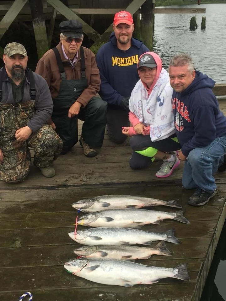 Group of fishermen with chinook salmon they caught in Oregon