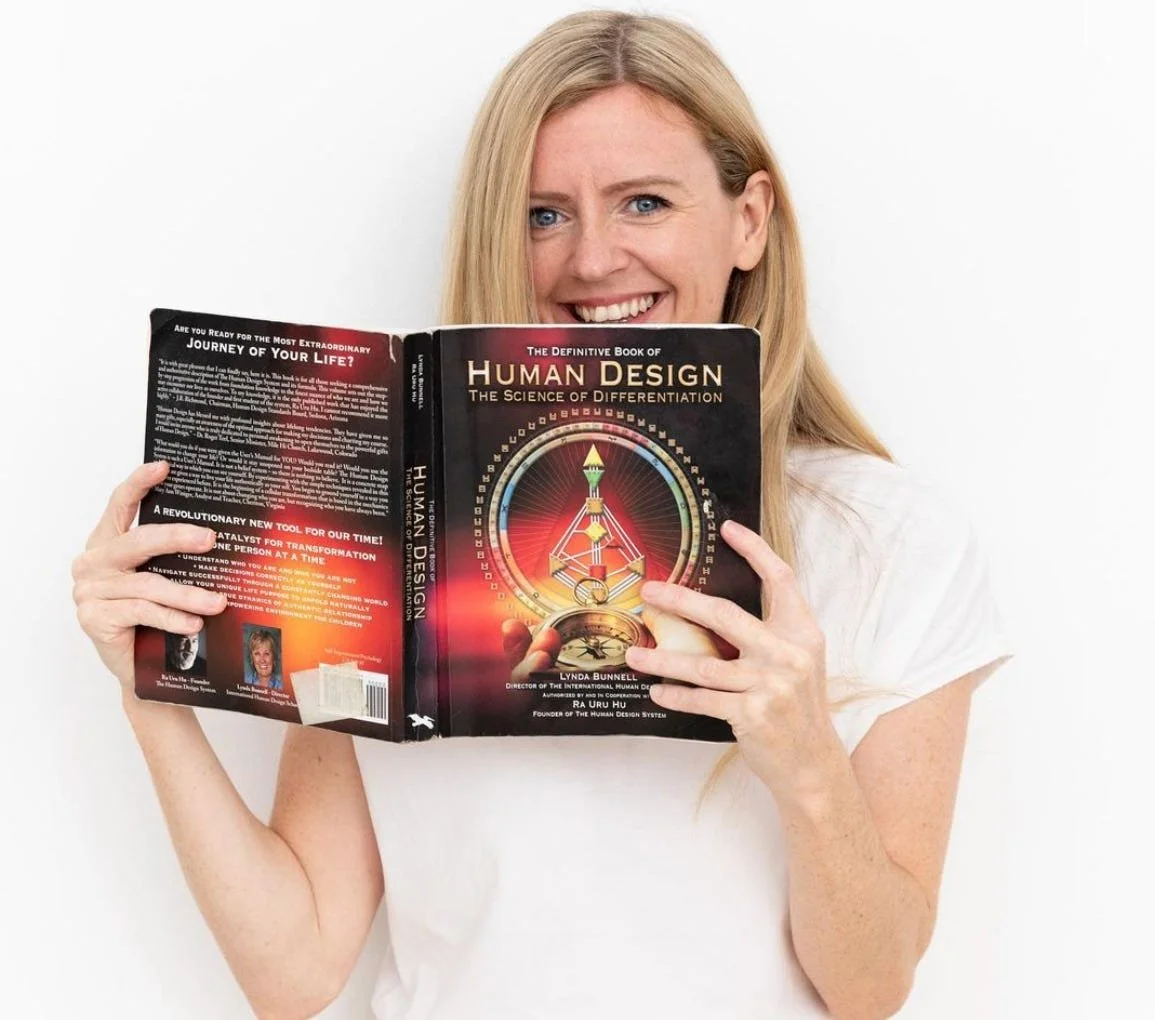 Abbey Rae Wilson, Human Design expert and menstrual cycle coach, smiling in a peaceful, thoughtful setting, embodying empowerment, clarity, and alignment with natural rhythms.