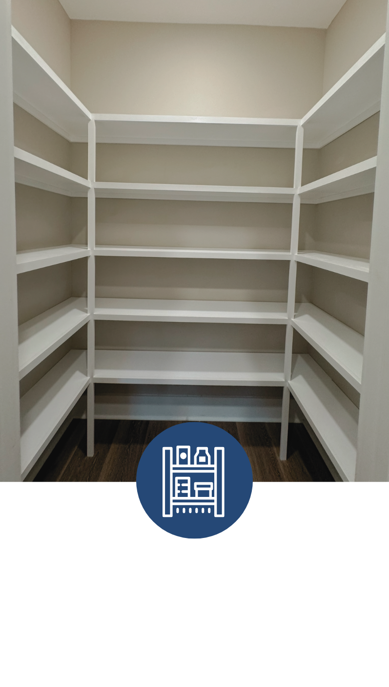 Empty white pantry with multiple shelves, beige walls, and dark wood floor.