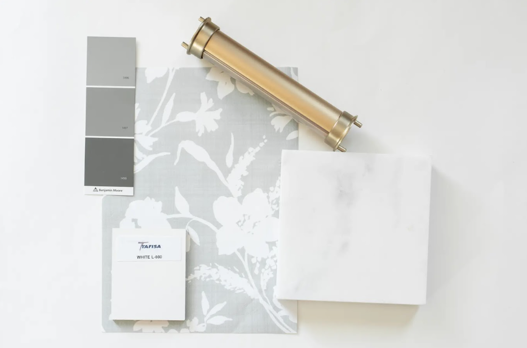 Interior home design sample with paint color palette, fabric swatch, wallpaper sample, a white tile, and a gold roller.