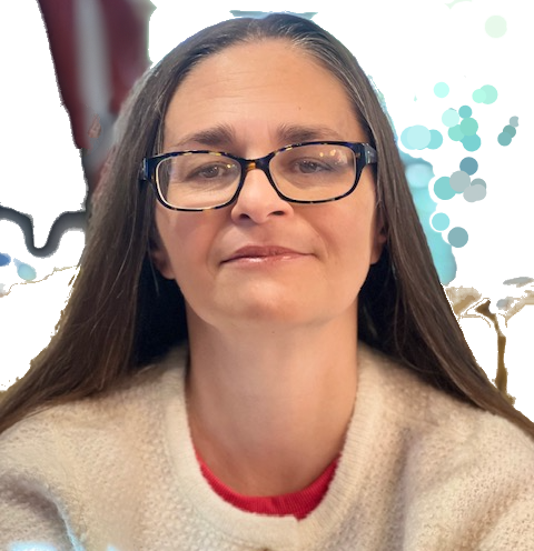 A woman with long brown hair and glasses, wearing a white sweater with a red collar, smiling softly at the camera.